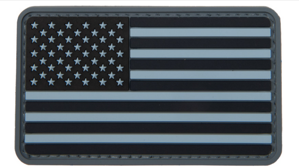 Navy blue forward-facing USA flag PVC morale patch with hook-and-loop backing.