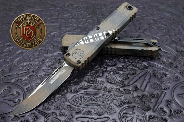 Microtech Ultratech Gen IV Wookiee Signature Series OTF knife open with Wookiee Cerakote drop point blade on display mat
