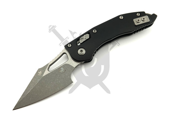 Microtech M-Stitch RAM-LOK 169MRL-10AP manual folding knife with black aluminum handle and apocalyptic M390MK Wharncliffe blade open front view