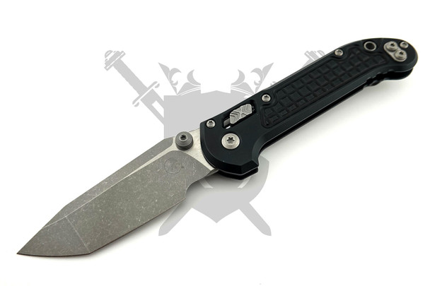 Microtech LUDT RAM-LOK manual folding knife with black Frag-pattern G-10 handle and apocalyptic stonewashed M390MK tanto blade open.