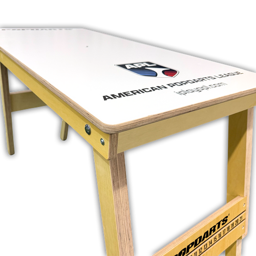close up of American Popdart logo on official APL table