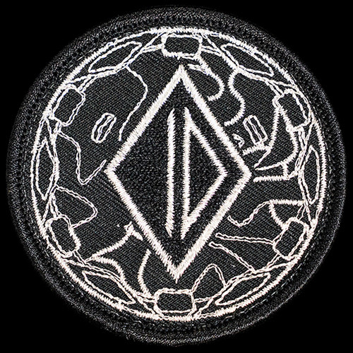 Embroidered ID logo and Hesychia end cap patterned circular kit patch with velcro backing. Made in America.