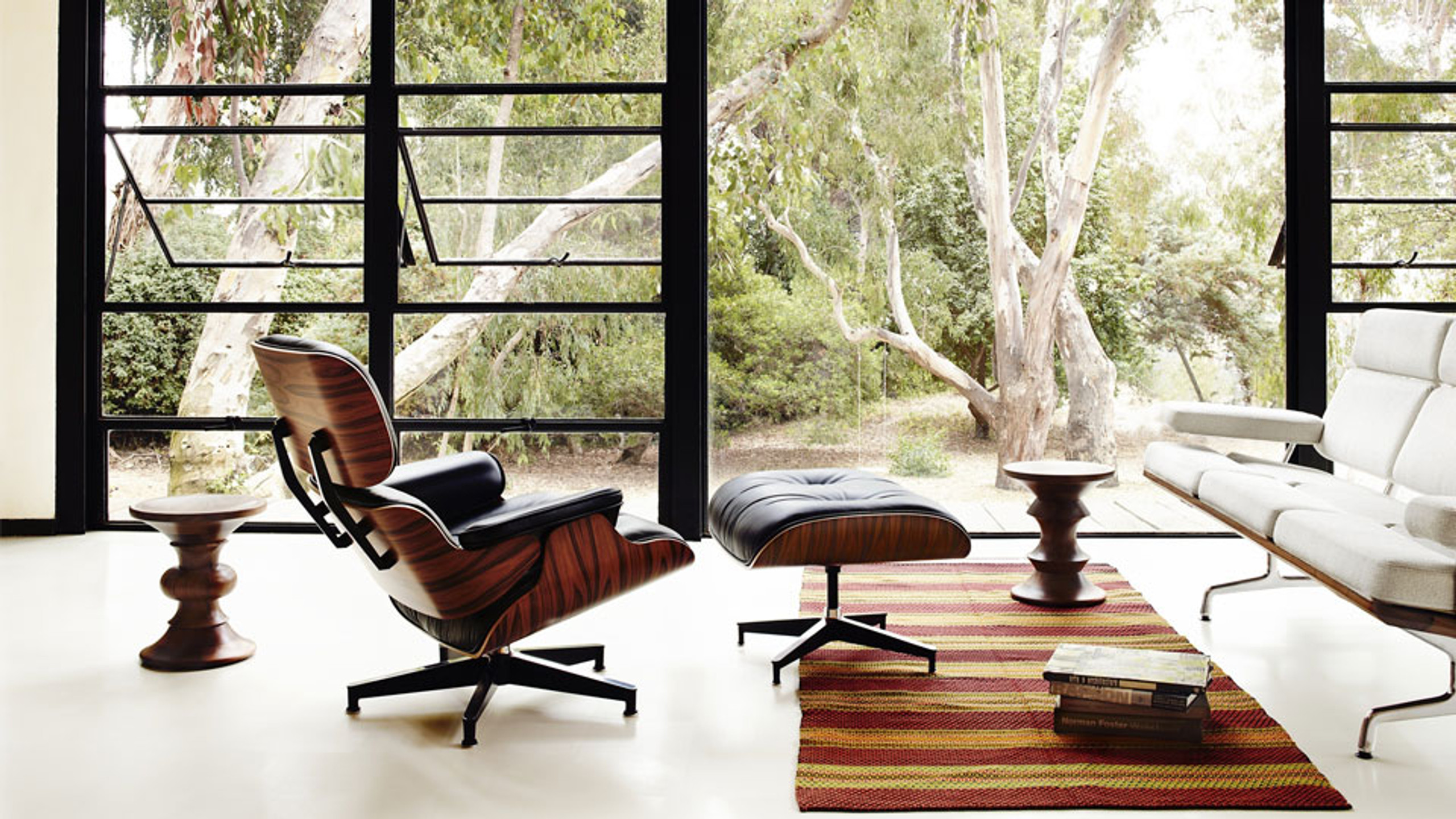 A green louis vuitton bag sitting on top of a wooden table photo