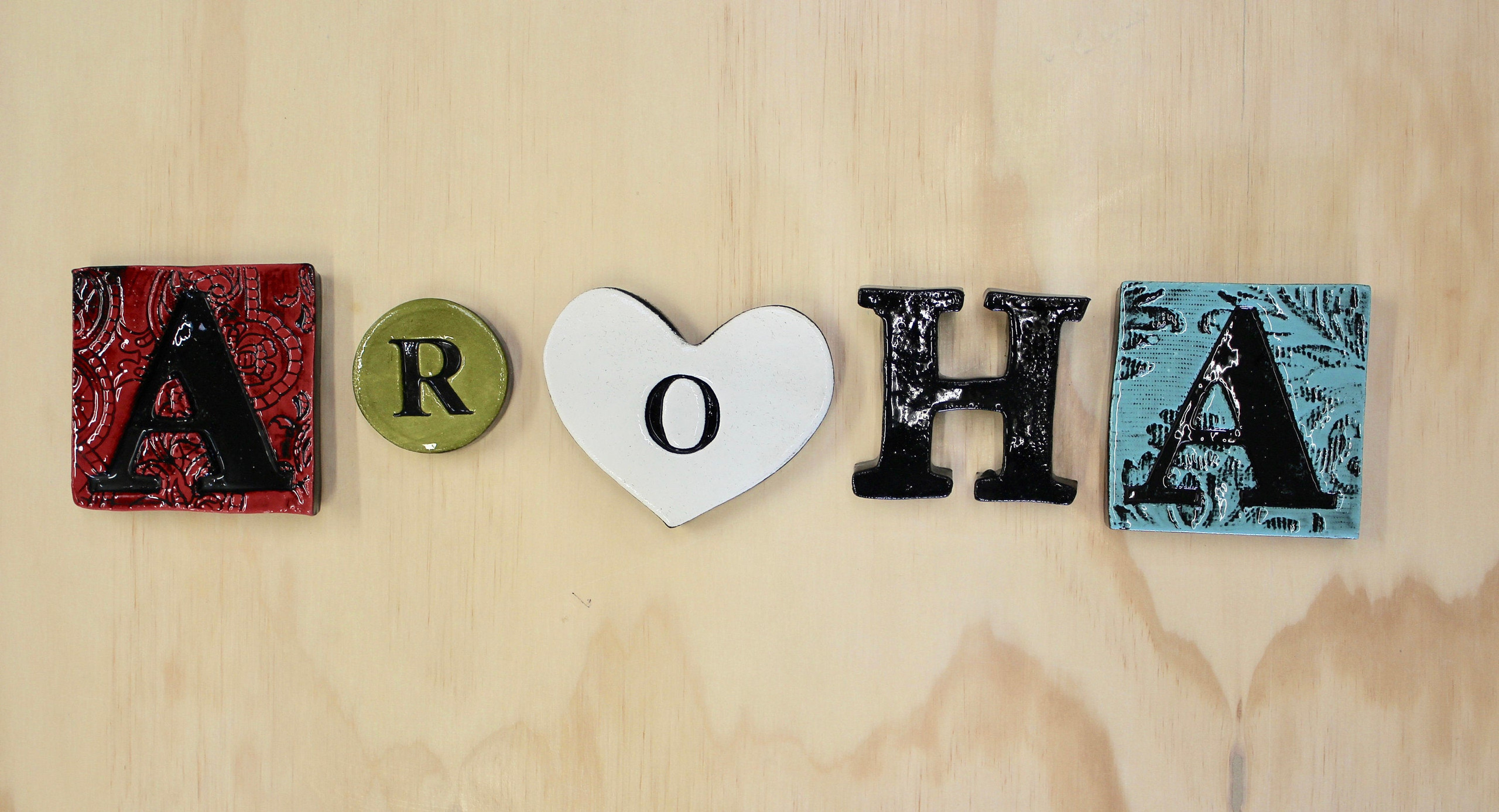Aroha word Ceramic wall art by New Zealand ceramic artist Hayley