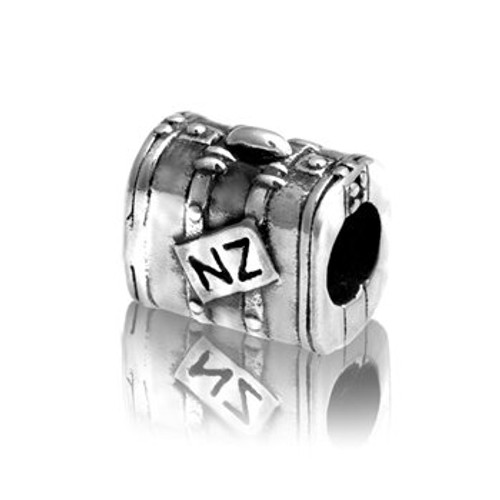 Sterling silver travel case charm from Evolve New Zealand.