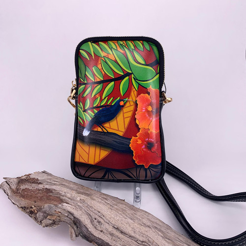 Leather cell phone bag with imagery of a huia bird and flora.