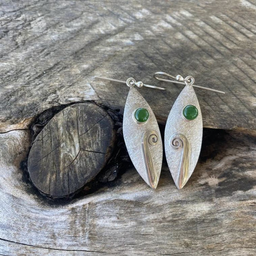 Silver elliptical koru and pounamu dot earrings