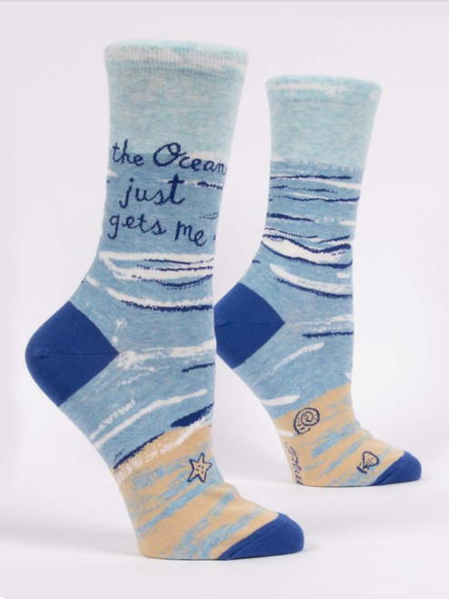Women's socks decorated with #The ocean just gets me".