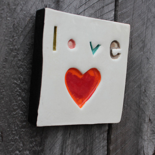 Ceramic love stamped wall tile from The Monster Company. Made in NZ.