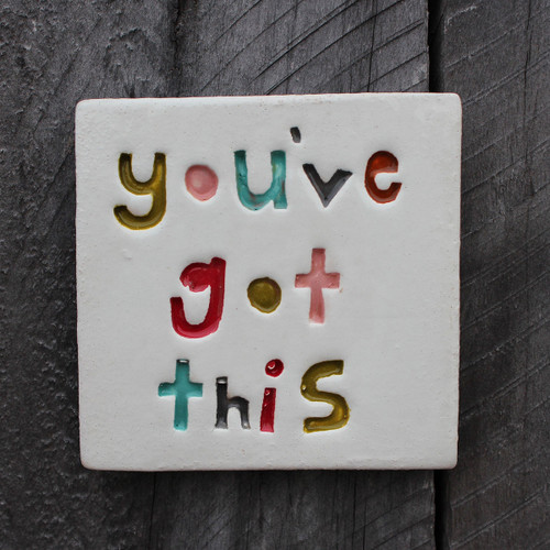 You've got this stamped ceramic tile from The Monster Company. Made in NZ.