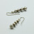 Brass and silver periperi earrings, Justin Ferguson.