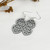 Double kowhaiwhai heart earrings in metallic finish silver resin
