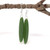 Oval pounamu green resin earrings with a kowhaiwhai design.