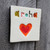 Ceramic aroha stamped wall tile from The Monster Company. Made in NZ.