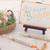 A lifestyle image of Kuretake ZIG Calligraphy Markers in use on a birthday card.
