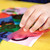 A lifestyle image of Pacon Spectra Deluxe Bleeding Art Tissue in use.