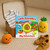 A lifestyle image of a House Of Marbles Little Avocado's Big Adventure Finger Puppet Board Book.