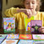 A lifestyle image of an EeBoo Fairytale Mix-Ups Create-A-Story Card Game.