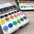 A lifestyle swatch image of Yasutomo Niji Artist Watercolor Sets.