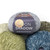 An image of a pile of Plymouth Moon Shadow Yarn.
