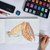 A lifestyle image of a Finetec Pearlescent Colorful Watercolor Set in use.