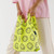 A lifestyle image of a Baggu Baby Reusable Bag in hand.