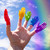 A lifestyle image of Archie McPhee Rainbow Hand Finger Puppets in use.