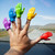 A second lifestyle image of Archie McPhee Rainbow Hand Finger Puppets in use.