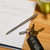 A lifestyle image of a Kikkerland Telescopic Mini Pen.