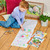 A lifestyle image of an EeBoo Dinosaurs Abound Fold-Out Coloring Book.