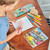 A lifestyle image of an EeBoo Dinosaur Sketchbook in use.
