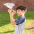 A lifestyle image of a Huckleberry Paper Plane Launcher in use.