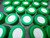 SeptaSecure centrifuge tube caps with uncut septa, designed for 15 mL centrifuge tubes, displayed in a staggered pattern. The caps are engineered to protect sample integrity and ensure easy access in laboratory procedures. Perfect for robotic processes.