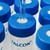 A pipet dispensing into a 50 mL Type-F tube that is securely capped with a blue Type-F centrifuge tube cap featuring a SeptaSecure white cross-cut septum. The image demonstrates the practical use of these easy-access septa caps in laboratory environments.