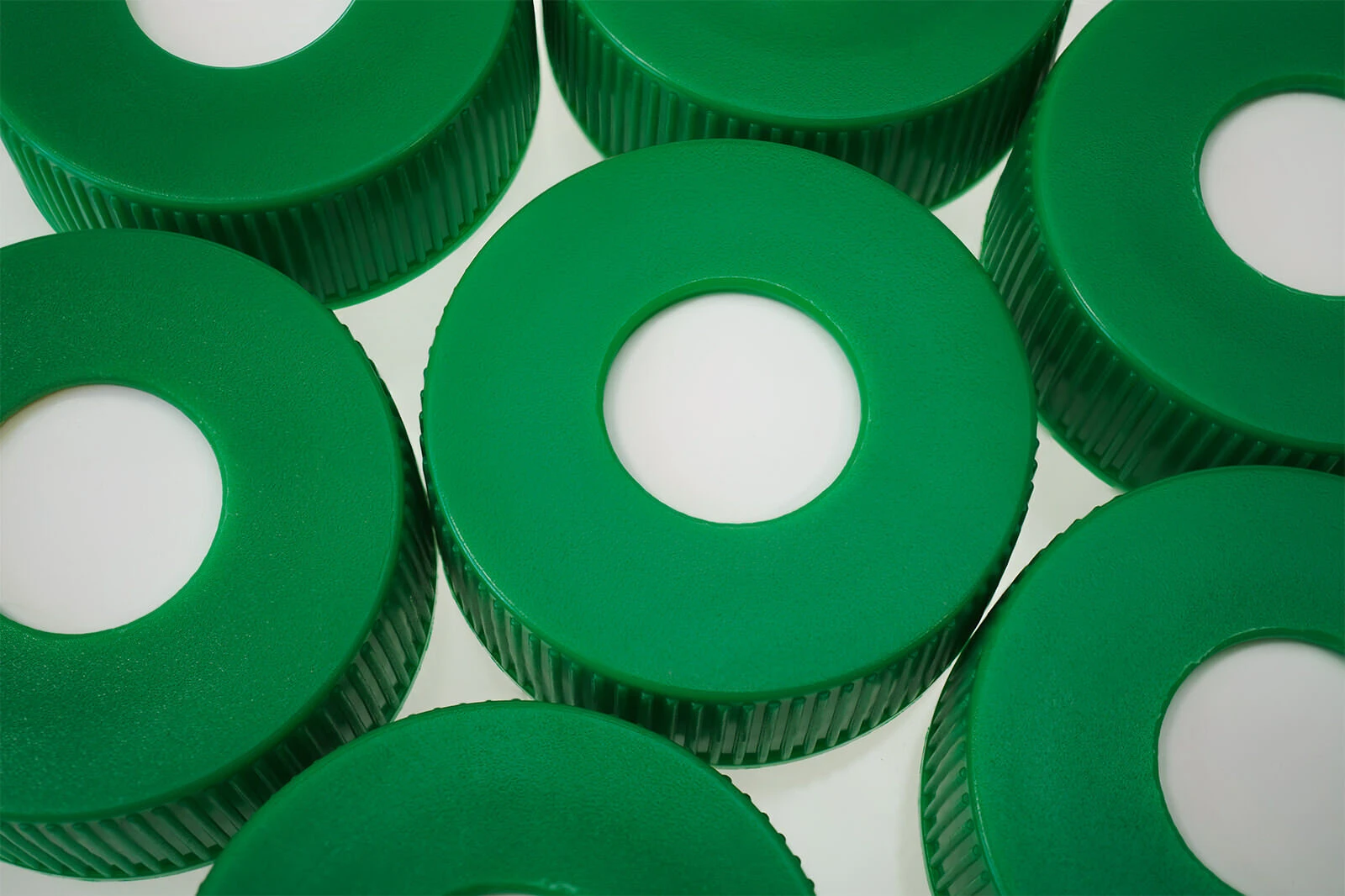 SeptaSecure blue silicone septa caps in a group of six.
