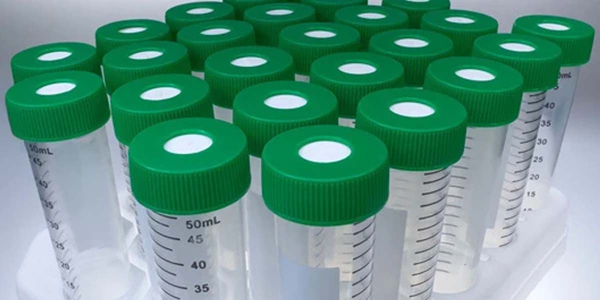 A rack of 50mL SeptaSecure centrifuge tubes with green cross-cut silicone septa caps