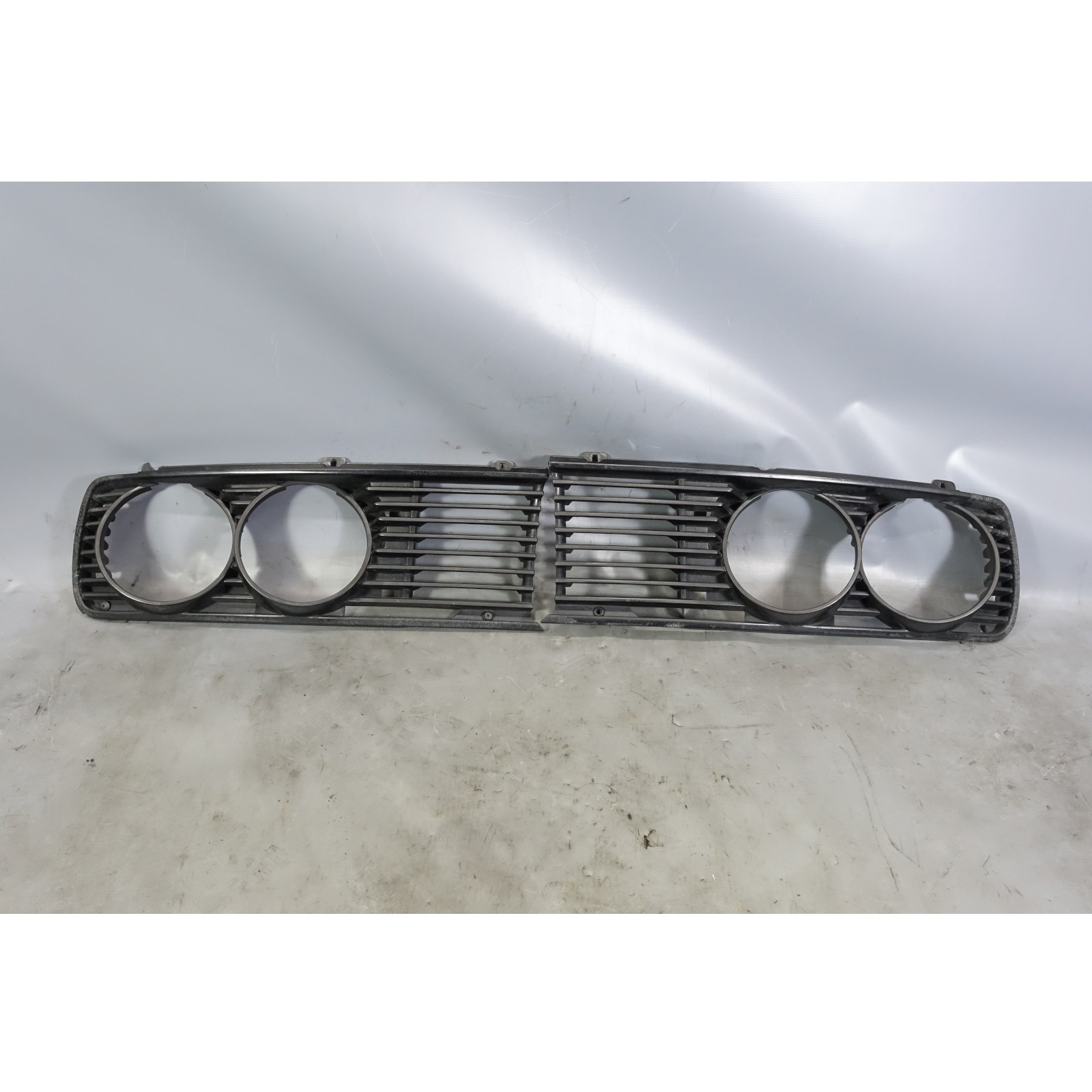 Damaged 1982-1988 BMW E28 528e 533i Factory Headlight Grille Pair