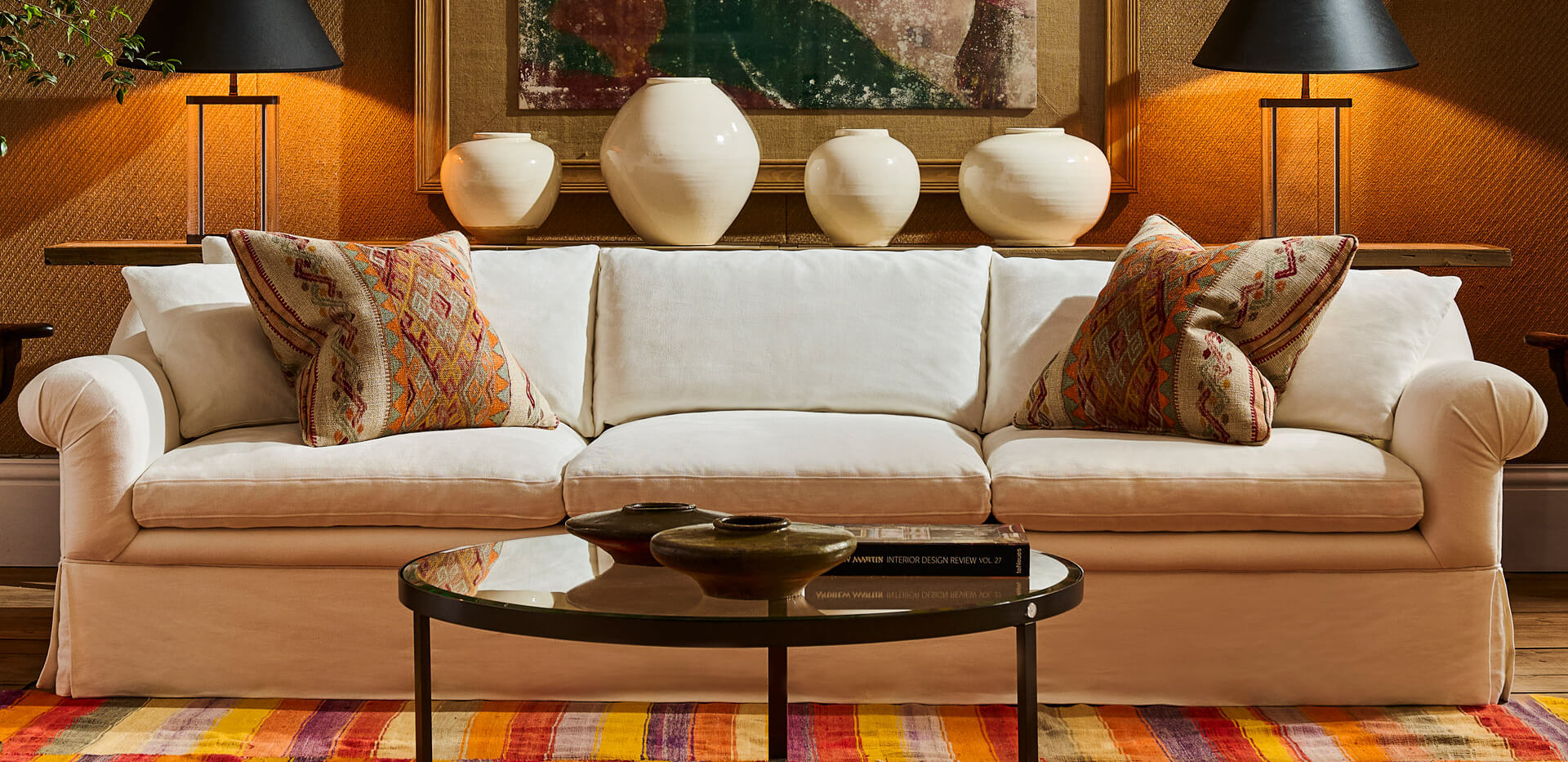 a white sofa in a vibrantly living room