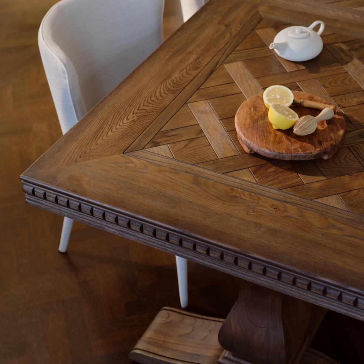 The corner of a detailed timber dining table 