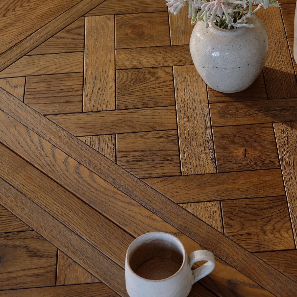 A close up of the parquetry top of a dining table