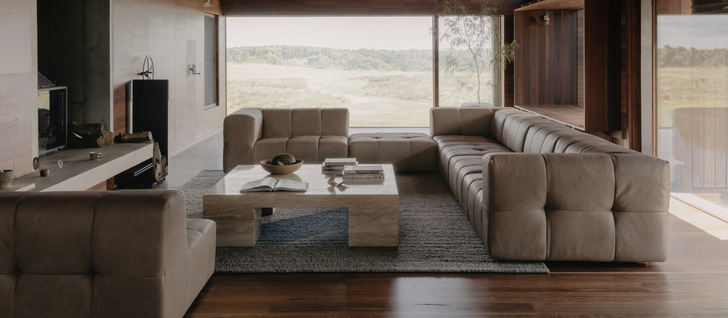 A large square-form sofa in a living room
