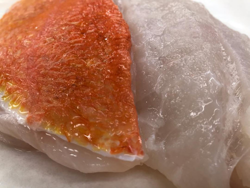 Wild Alaskan Yelloweye Rockfish have beautiful orange flesh and translucent white meat.
