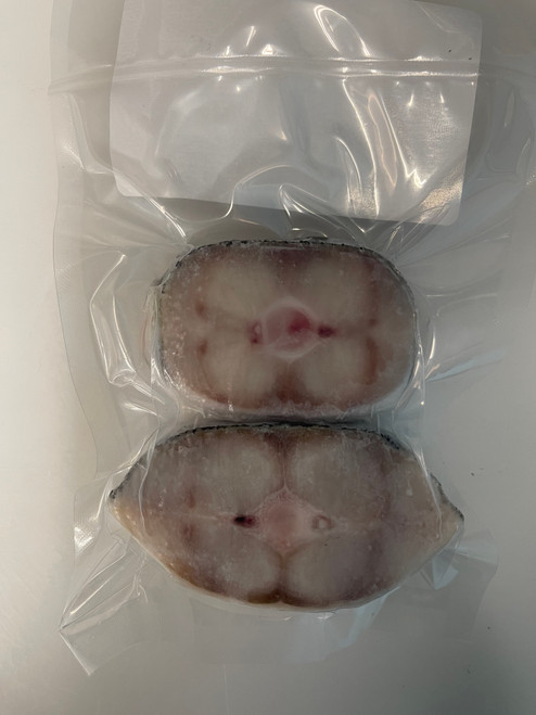 Two mini wild Alaskan halibut steaks, approximately 2–4 oz each