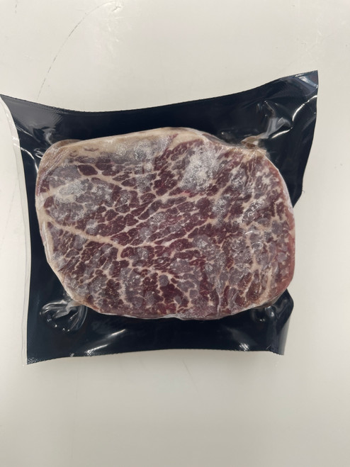 Raw 8+ BMS Australian Wagyu 6 oz filet mignon steak showing heavy marbling