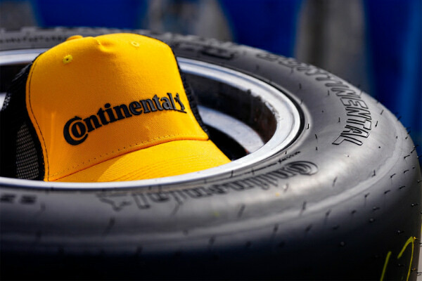 Continental branded hat sitting inside a Continental racing tire