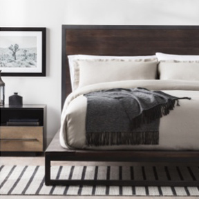 Bed made on wooden platform bed