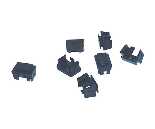 Multiple black plastic SFP port dust covers arranged in a loose group.