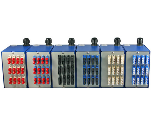 Six SNAP XL fiber patch panels with various colored connector ports arranged in a row.