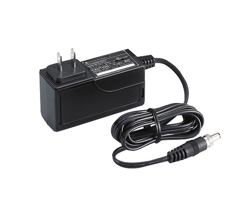 Black wall-plug power adapter with a coiled cable and DC connector.
