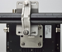 PK-DC2DOF Pole Mount Kit secured to a horizontal pole on a black device.
